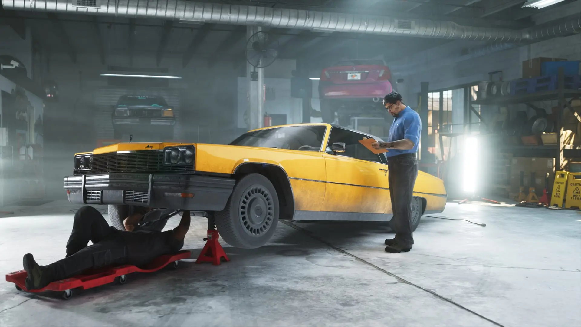 Mechanic lying under a yellow classic coupe on a red lift while another man checks a clipboard.