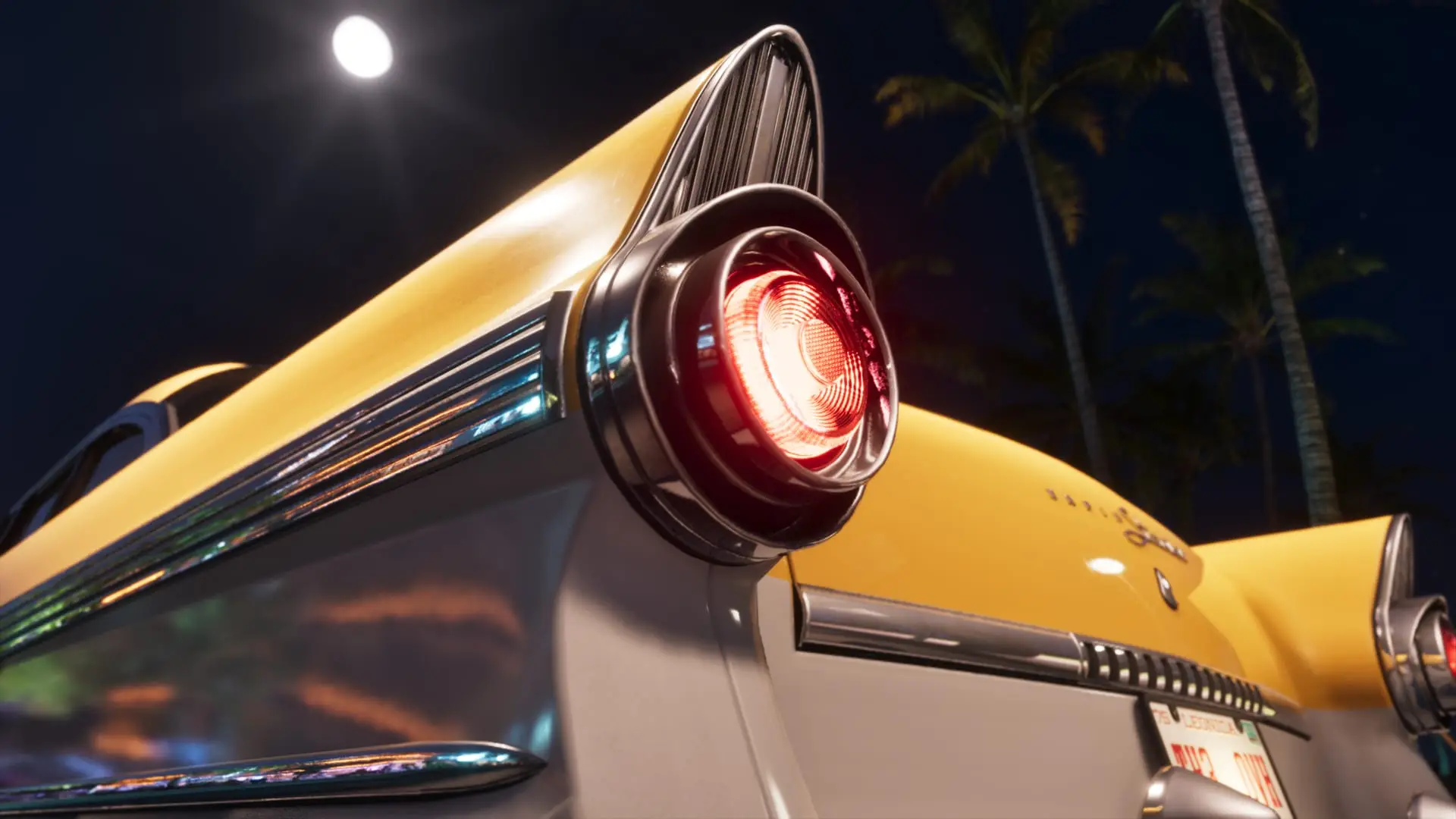 Red tail light of a yellow vintage car at night, with palm trees and a full moon behind.